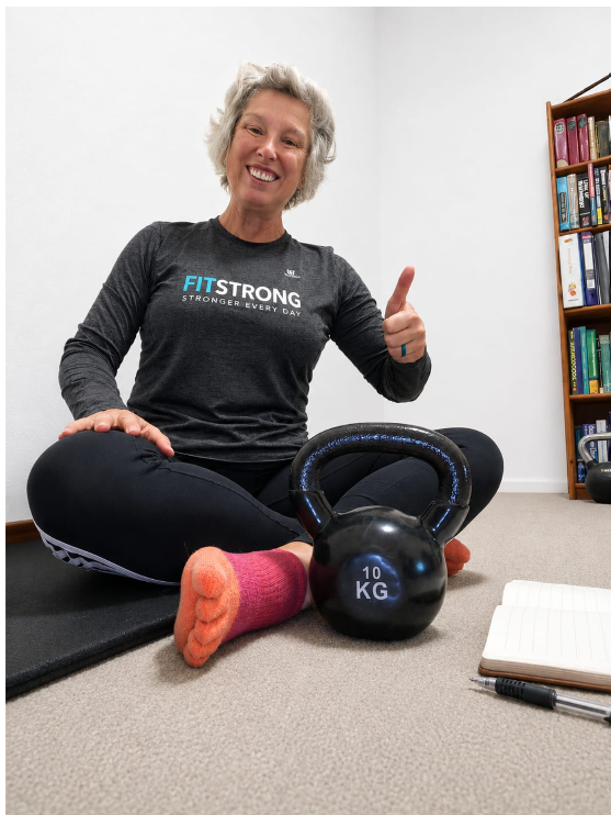 Maaike Hunter seated with a kettlebell