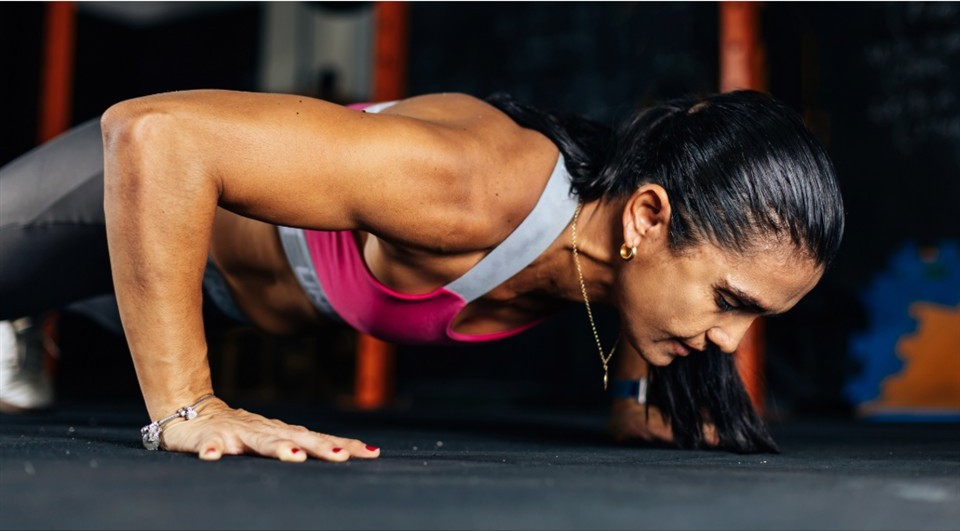 Woman performing a push-up during strength training